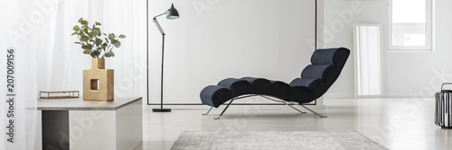 Chaise lounge in white interior
