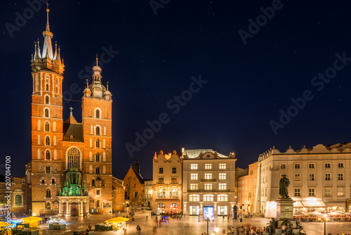beautiful night view of the market square and the church in the center of Krakow
