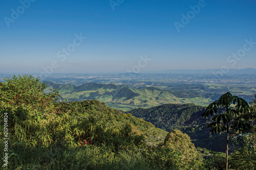 Panoramic view of forest, hills, mountains and blue sky in Penedo, a tourist town founded by Finns who still has strong influence of this culture. Located in Rio de Janeiro State, southwestern Brazil photo