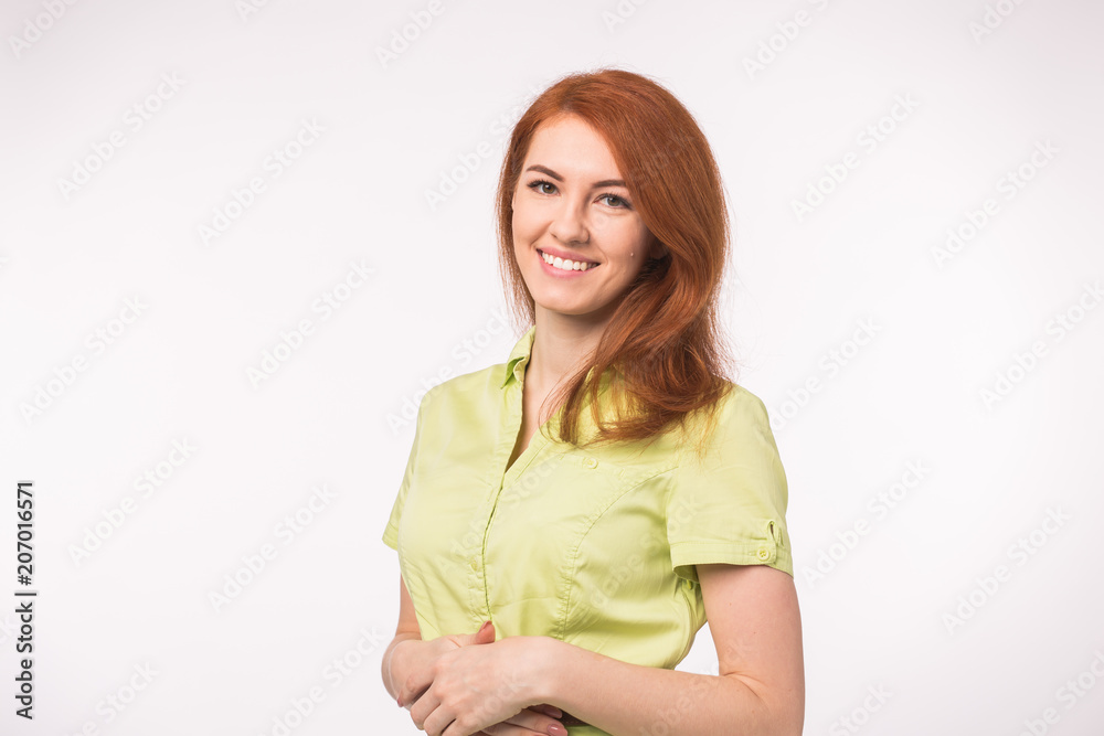 Beautiful young woman with red hair on white background Beautiful young woman with red hair on white background