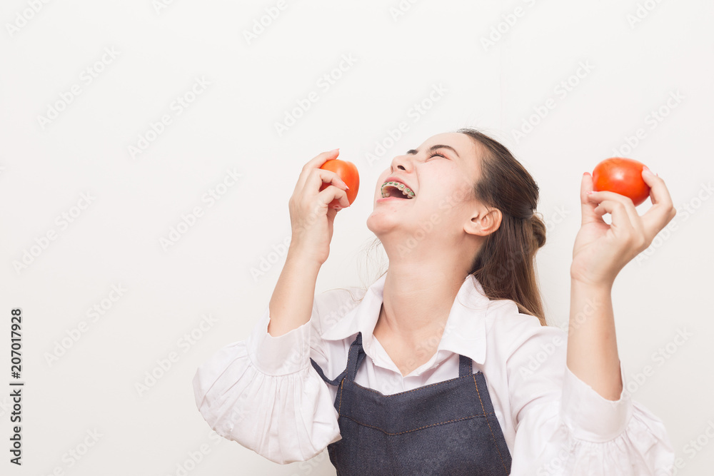 Happiness Young asian woman holding red tomatos. Happiness Young asian woman holding red tomatos.