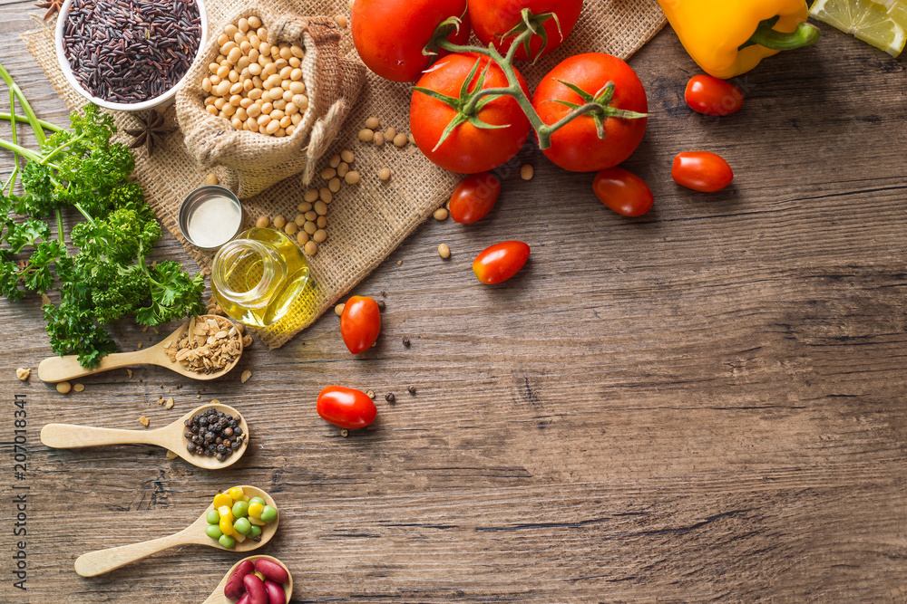 A Low key picture of Healthy food background ,fruits and vegetables on old wooden table. A Low key picture of Healthy food background ,fruits and vegetables on old wooden table.
