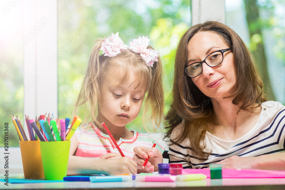 Happy family. Mother and daughter together paint. Happy family. Mother and daughter together paint.