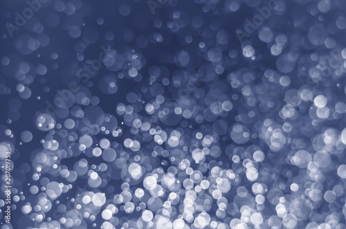 abstract blue bokeh glitter sparkle background.