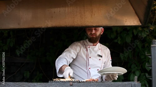 Fresh shrimp grilled by chef in restaurant photo