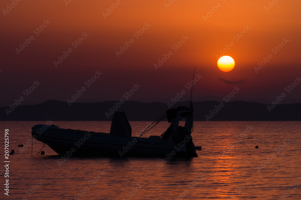Boat in sunrise; Marathonas beach, Athens area, Greece