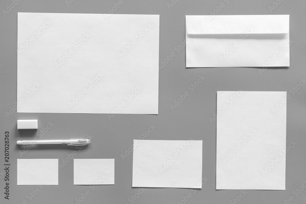 Mockup template for branding identity. White stationery on grey background top view. Pattern Mockup template for branding identity. White stationery on grey background top view. Pattern