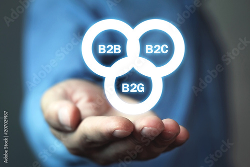 Businessman holding B2B, B2C, B2G business models. Business concept photo