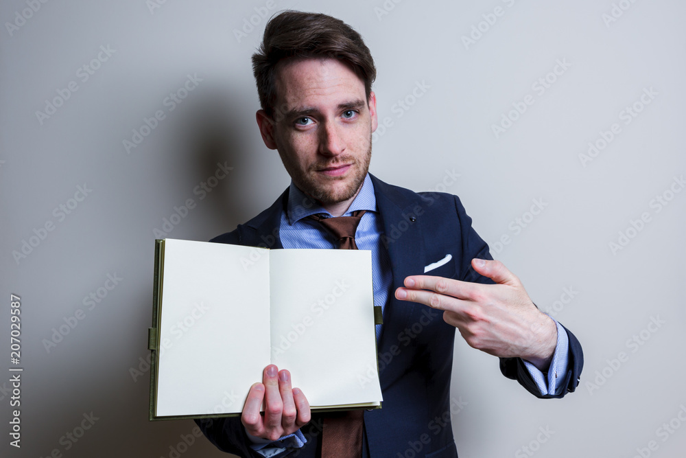 Business man showing blank note. Studio portrait isolated. Business man showing blank note. Studio portrait isolated.