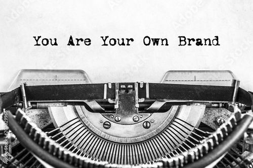 You Are Your Own Brand text typed on a vintage typewriter, old paper. close-up