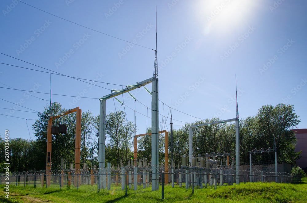 Fototapeta premium power station behind fence, transformer