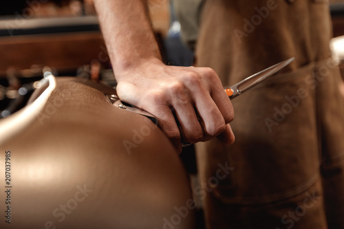 Barber and bearded man in barber shop