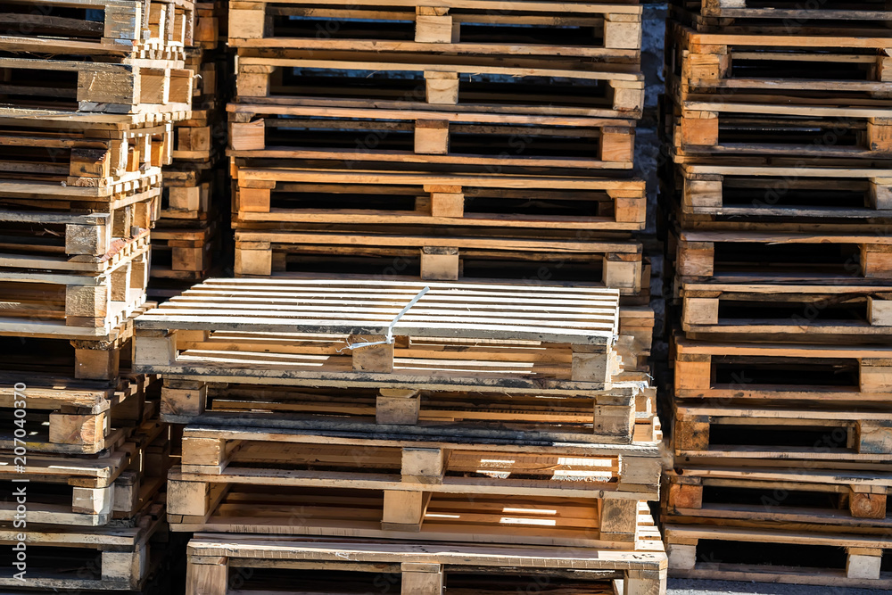 Fototapeta premium Stacked wooden pallets