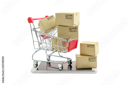 Online shopping with smart mobile device via internet concept : Red shopping cart on smart phone. Online shopping gains more popularity today due to its convenience and time saving. Isolated on white.