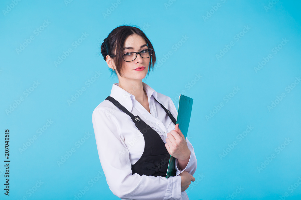 Business woman with folder on blue background Business woman with folder on blue background
