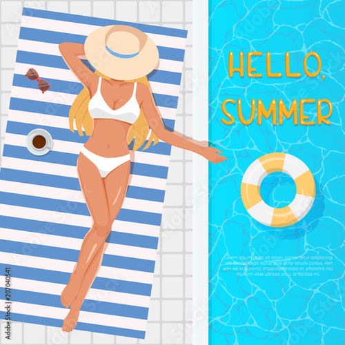 Woman in hat sunbathing on the beach towel near the swimming pool. Summer vacation concept. Top view of young blonde girl in white swimsuit sunbathing beside water pool