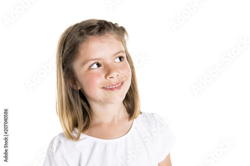 Portrait of a cute 7 years old girl Isolated over white background pensive