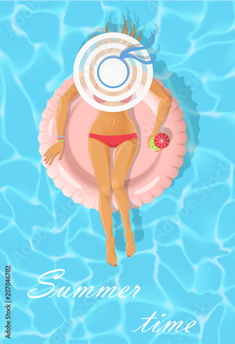 Sunbathing young woman on a pink floating mattress