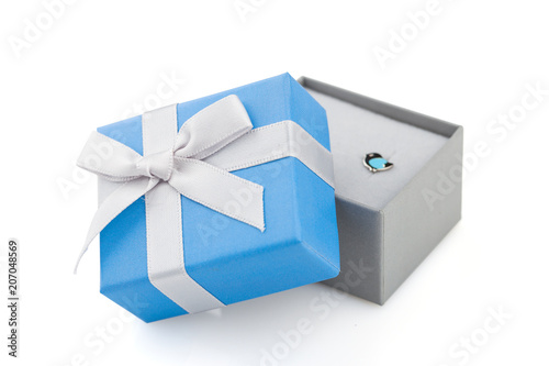 Small blue and gray jewelry gift boxes with bow isolated on white background