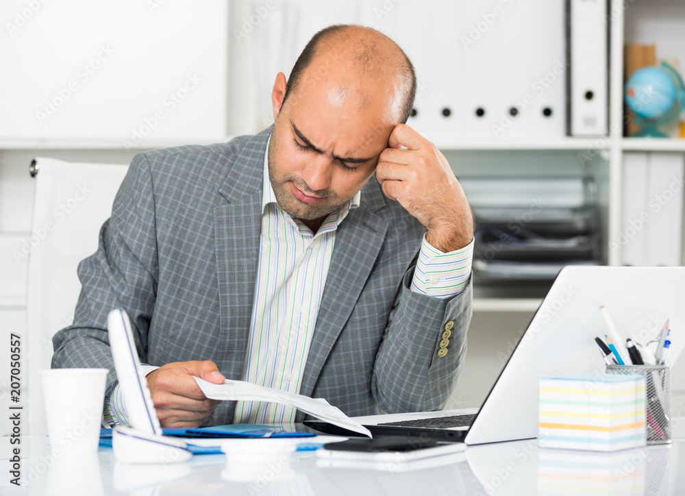 Naklejka premium Sad businessman thinking about work