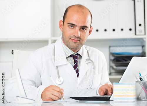 Medical worker in medical Center sitting at the table
