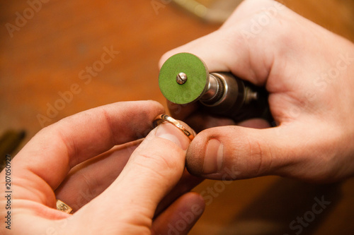 Jeweler makes a piece of jewelry
