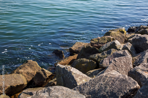 granite stone lie on the seashore.