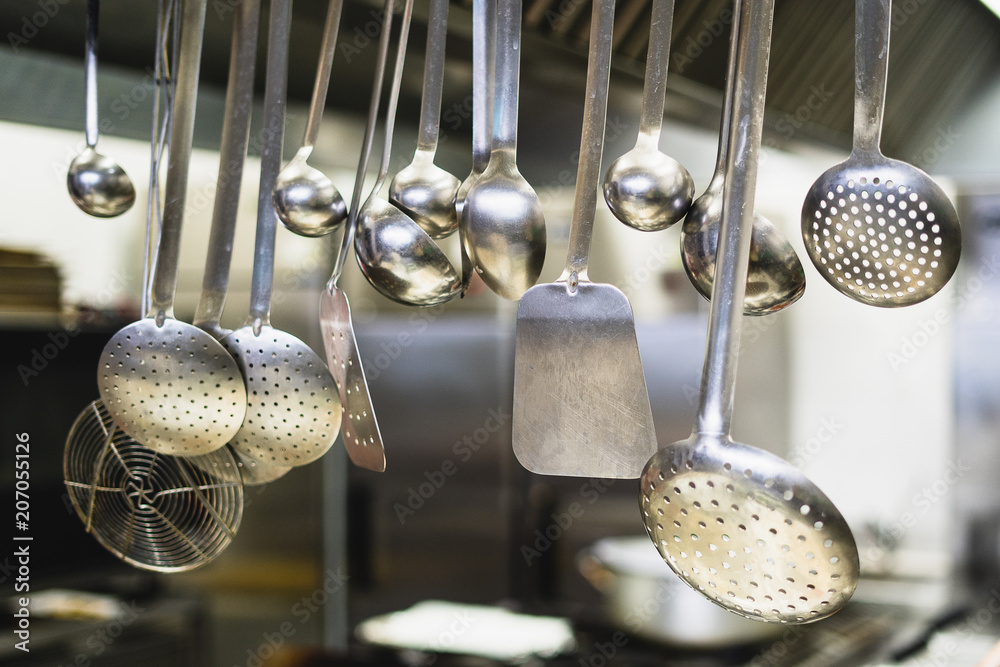 professional kitchen tools inside a restaurant: spatula, skimmer, ladle,  spoon Stock Photo | Adobe Stock
