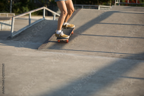 skateboarder skateboarding on skatepark ramp