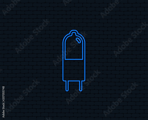 Neon light. Light bulb icon. Lamp G4 socket symbol. Led or halogen light sign. Glowing graphic design. Brick wall. Vector