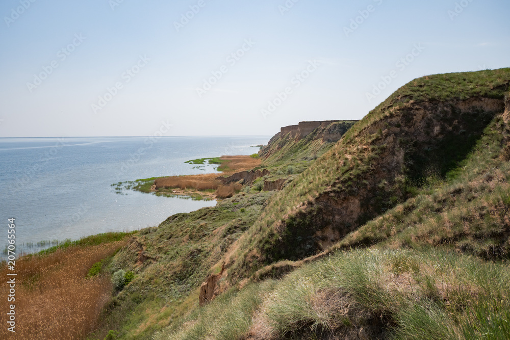 Beautiful summer landscapes with clay cliffs near delta of river Dnieper and Black sea