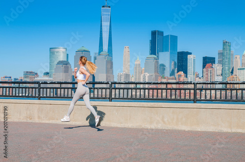 Healthy lifestyle. Woman is running in New York City © Dmytro Flisak