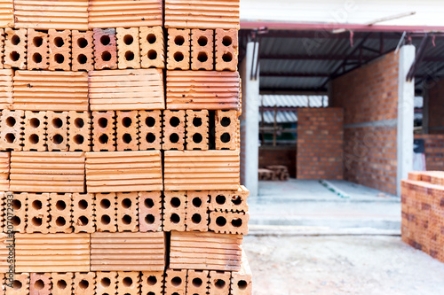 Industrial bricklayer installing bricks on construction site