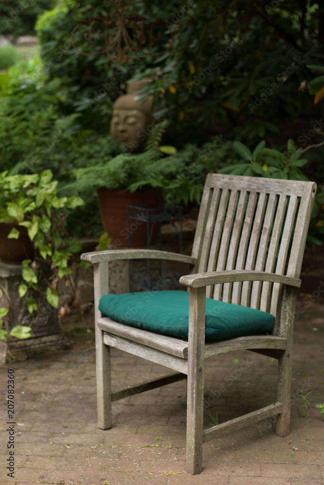 wooden chair on a patio in the garden