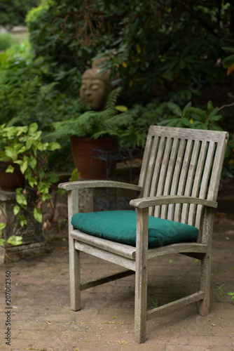 wooden chair on a patio in the garden