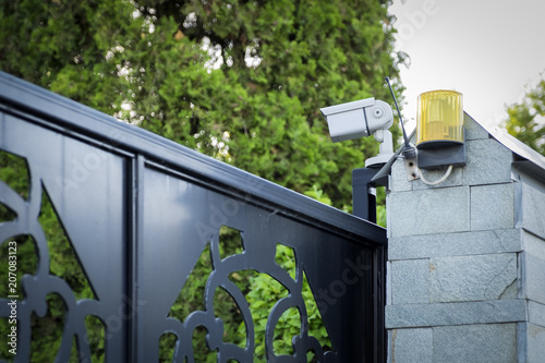 Street surveillance camera on the fence.