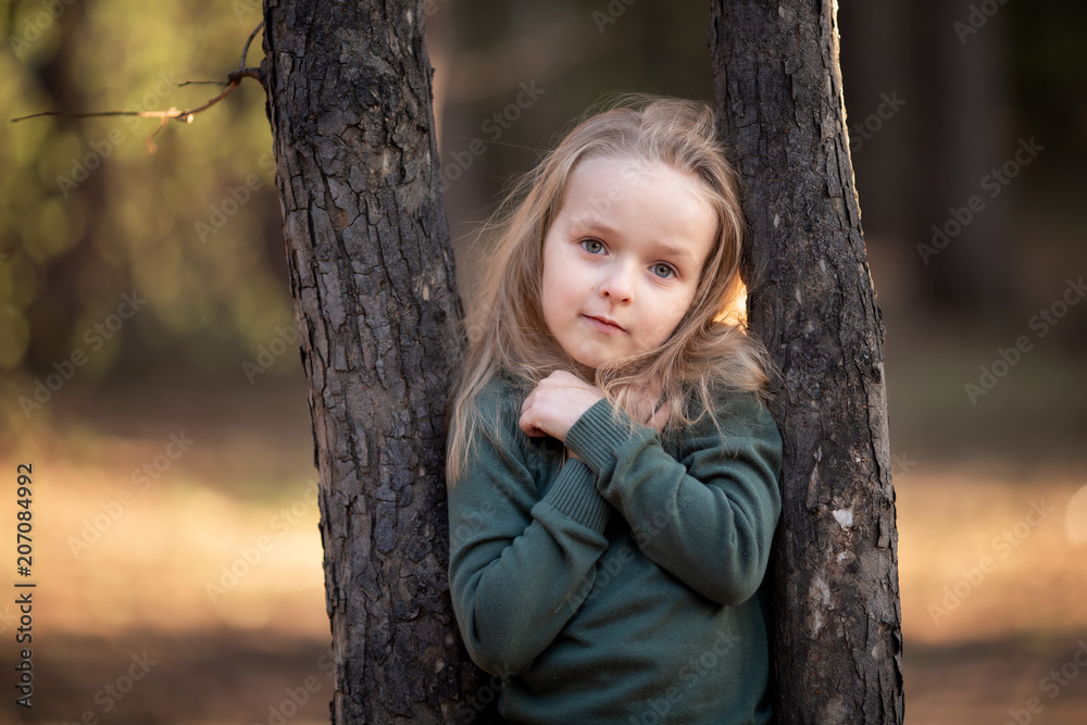 A beautiful portrait of a girl at a tree A beautiful portrait of a girl at a tree
