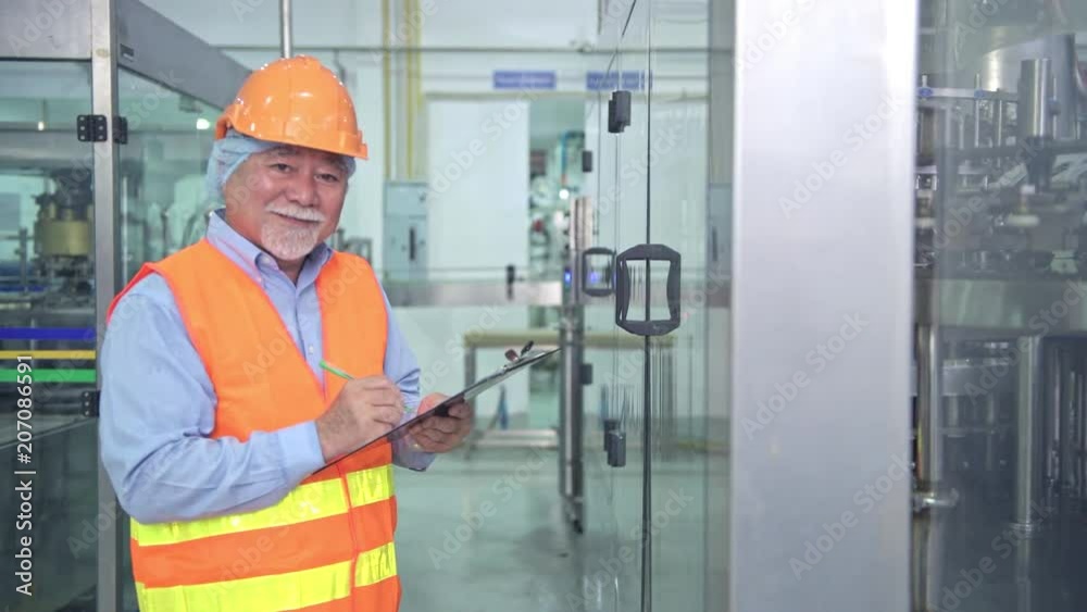 Quality inspection in factory. Senior chinese quality assurance team