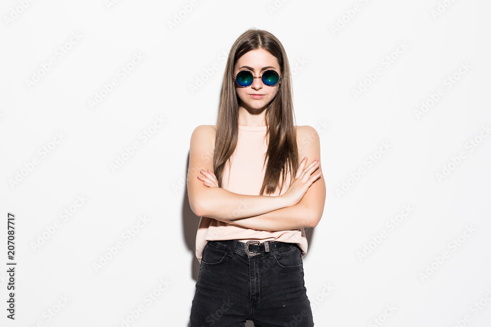 Young teenage woman wearing sunglasses isolated on white