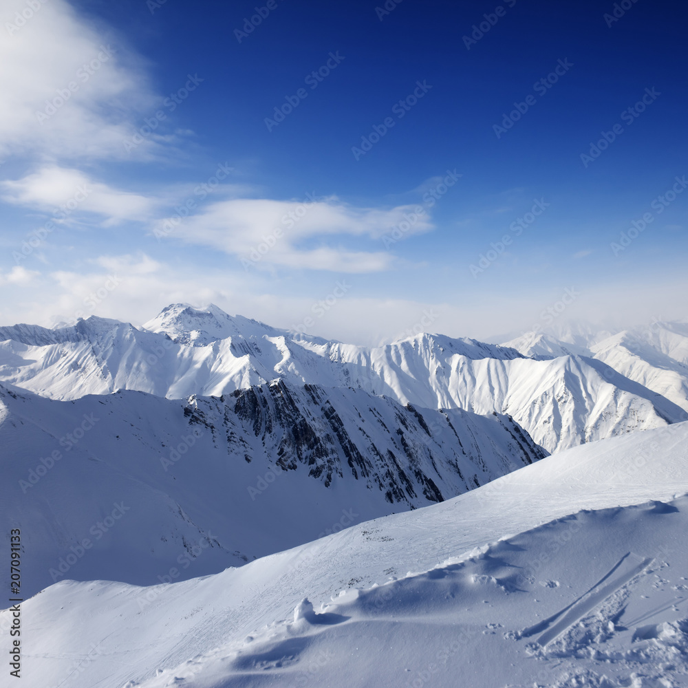Snowy mountains and blue sky