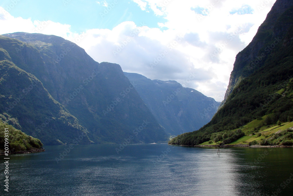 Panorama of the Norwegian fjords under the sun's rays of the Scandinavian summer.