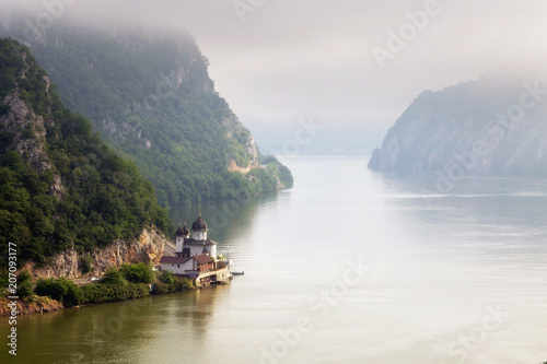 Summer landscape of Danube Gorge, at the border between Romania and Serbia. Mraconia orthodox monastery 