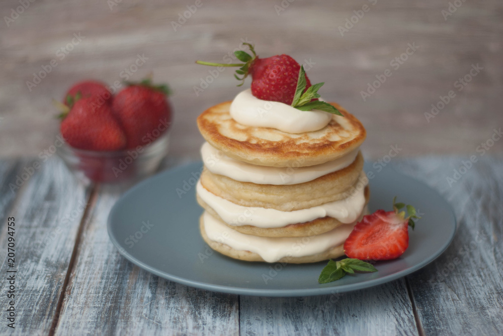 Sweet Pancakes with Cream and Strawbery. Health Breakfast Fruit Berry Vitamine Gray Rustic Wooden Background Sweet Pancakes with Cream and Strawbery. Health Breakfast Fruit Berry Vitamine Gray Rustic Wooden Background