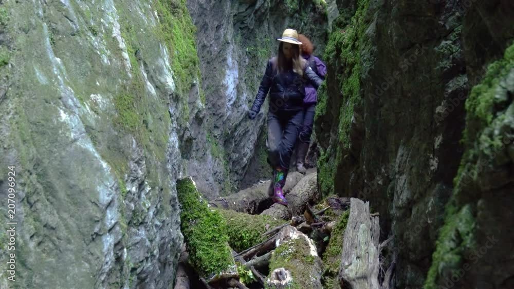 Girlfriends hiking in a canyon Girlfriends hiking in a canyon