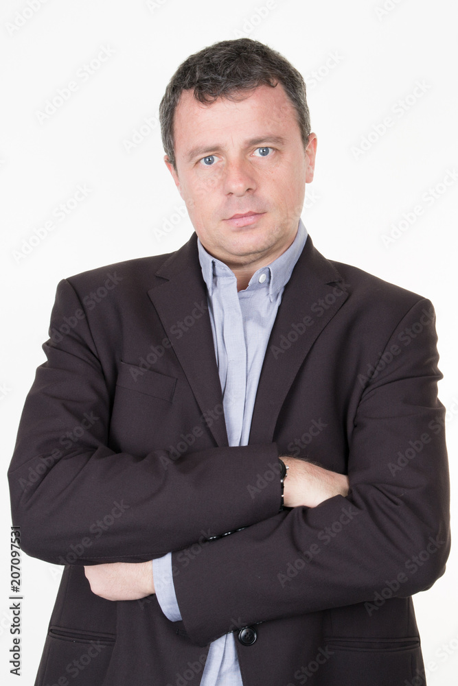 Portrait of serious businessman arms crossed isolated on white Portrait of serious businessman arms crossed isolated on white