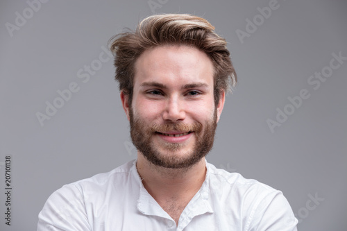 Portrait of a handsome blond young man smiling