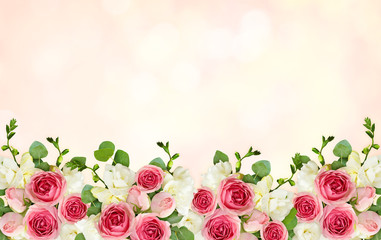 Pink background with eucalyptus leaves, freesia and pink rose flowers