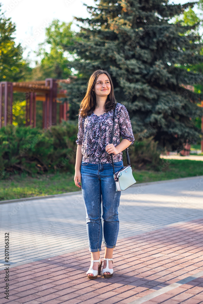 Girl walks in the summer park Girl walks in the summer park