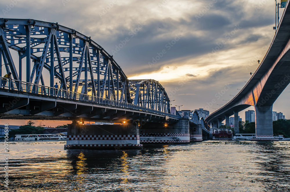 Krungthep - Rama III Bridge A bridge across the Chao Phraya River Between Ratchadapisek Road and Somdej Taksin Road in sunset ,Thon Buri in Bangkok Thailand.
