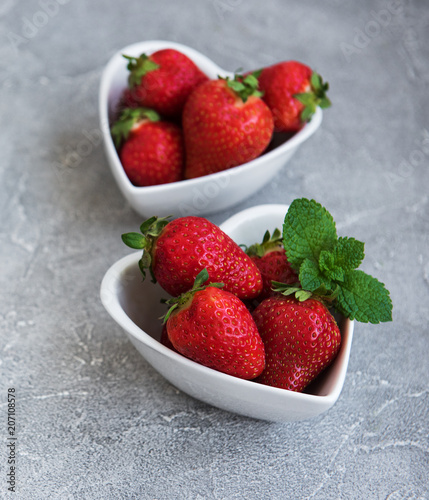 Bowls with fresh strawberries